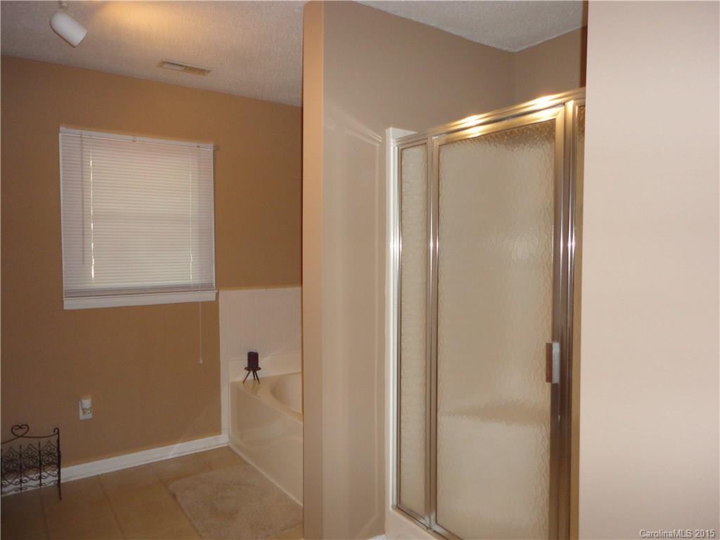 952 Pleasant Ridge Road, Unit 31 Fort Mill, SC 29715 - Photo 10 of 23 a bathroom with a glass shower door