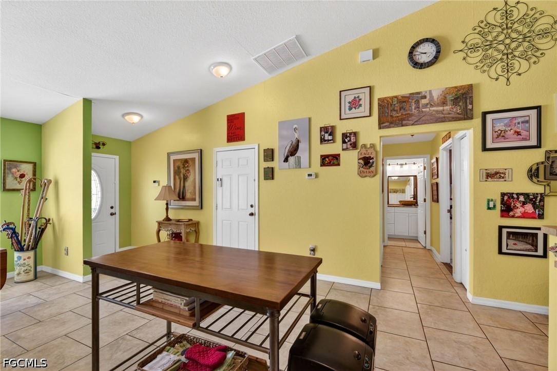 5520 Phillips Street Bokeelia, FL 33922 - Photo 15 of 50 a view of a dining room with furniture and a table