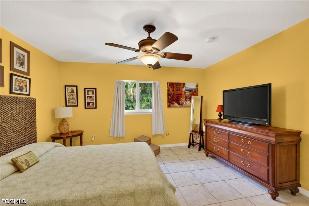 5520 Phillips Street Bokeelia, FL 33922 - Photo 23 of 50 a living room with furniture and a flat screen tv