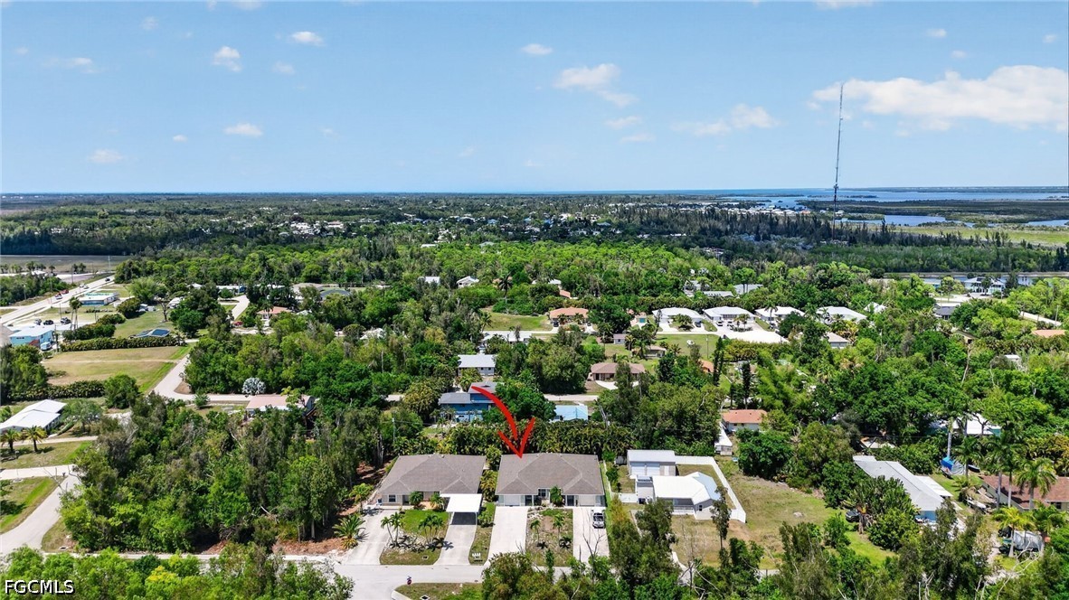 5520 Phillips Street Bokeelia, FL 33922 - Photo 38 of 50 an aerial view of a city with lots of residential buildings