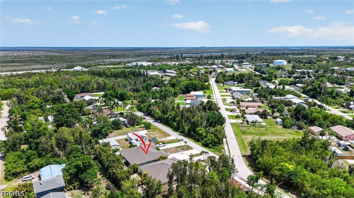5520 Phillips Street Bokeelia, FL 33922 - Photo 41 of 50 an aerial view of residential houses with outdoor space and trees