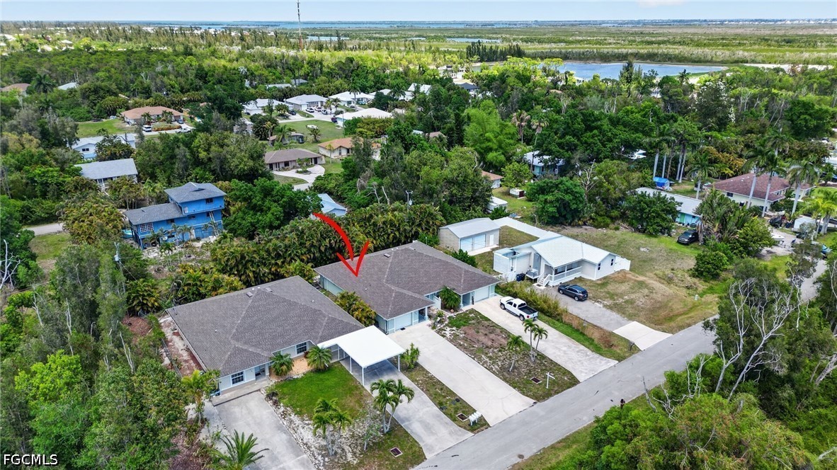 5520 Phillips Street Bokeelia, FL 33922 - Photo 49 of 50 an aerial view of multiple house