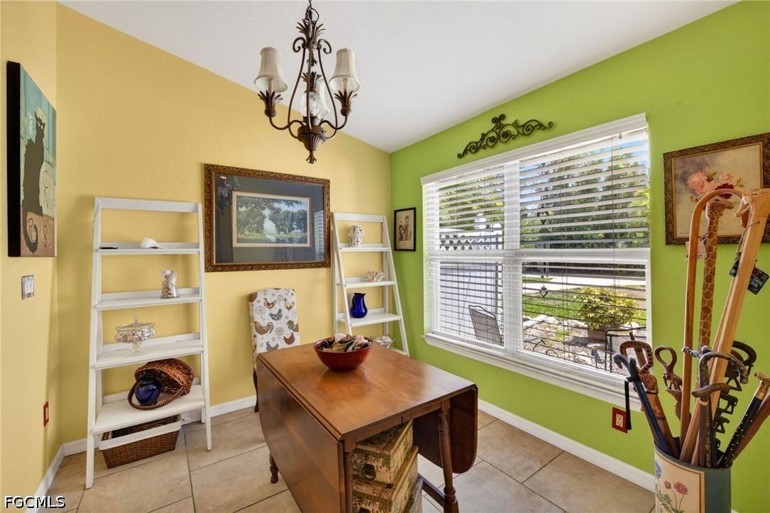 5520 Phillips Street Bokeelia, FL 33922 - Photo 6 of 50 a view of a dining room with furniture window and outside view