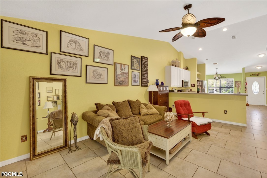 5520 Phillips Street Bokeelia, FL 33922 - Photo 9 of 50 a living room with furniture and kitchen view