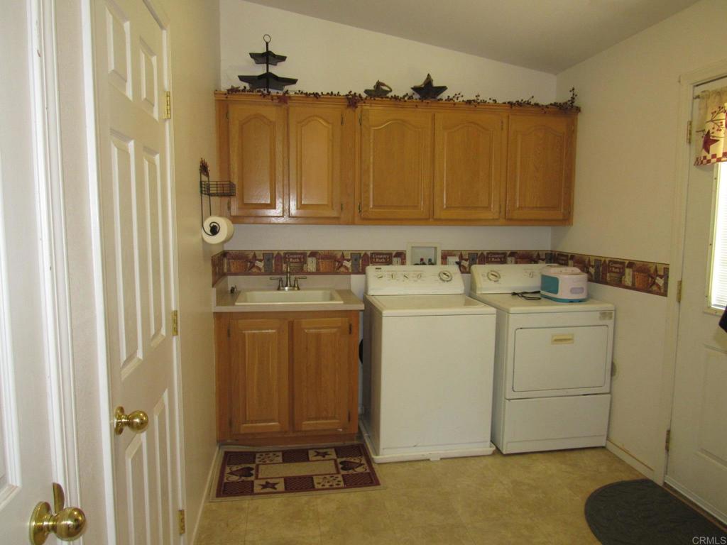 1124 Far Valley Road Campo, CA 91906 - Photo 15 of 21 a utility room with dryer and washer