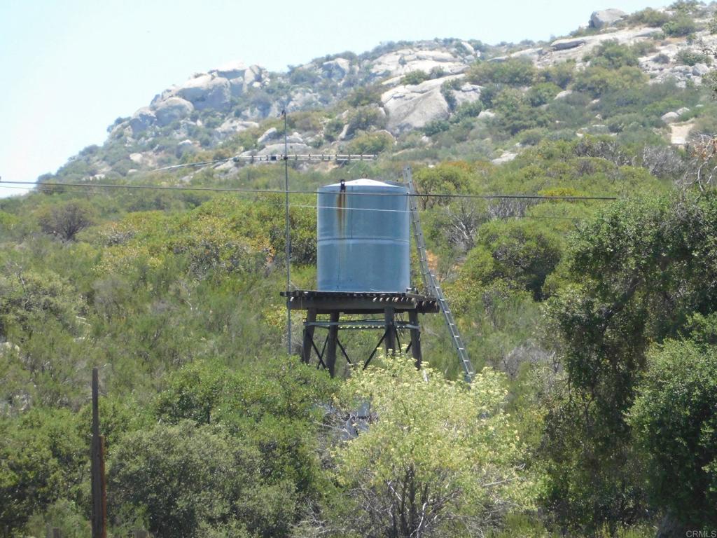 1124 Far Valley Road Campo, CA 91906 - Photo 19 of 21 a backyard of a house with a yard and mountain view