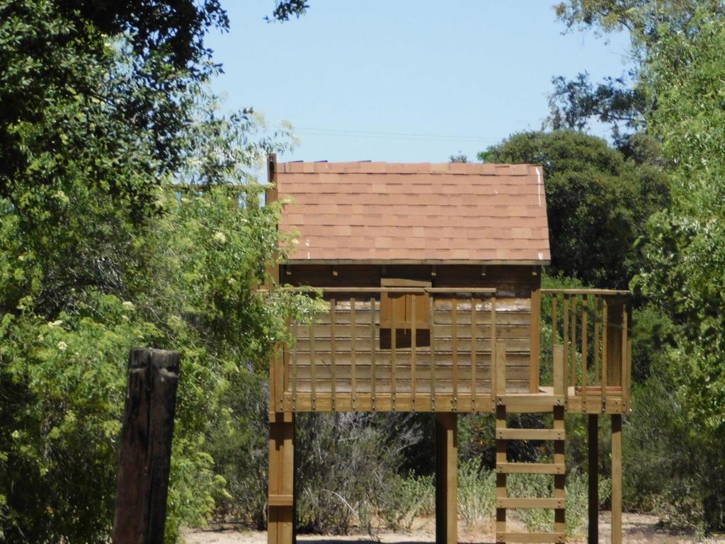 1124 Far Valley Road Campo, CA 91906 - Photo 20 of 21 an aerial view of a multi story residential apartment building with a yard