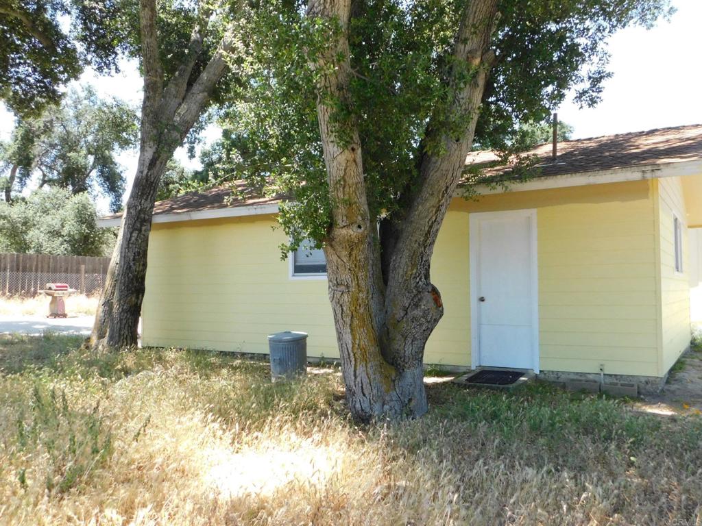 1124 Far Valley Road Campo, CA 91906 - Photo 2 of 21 a view of a yard with a tree