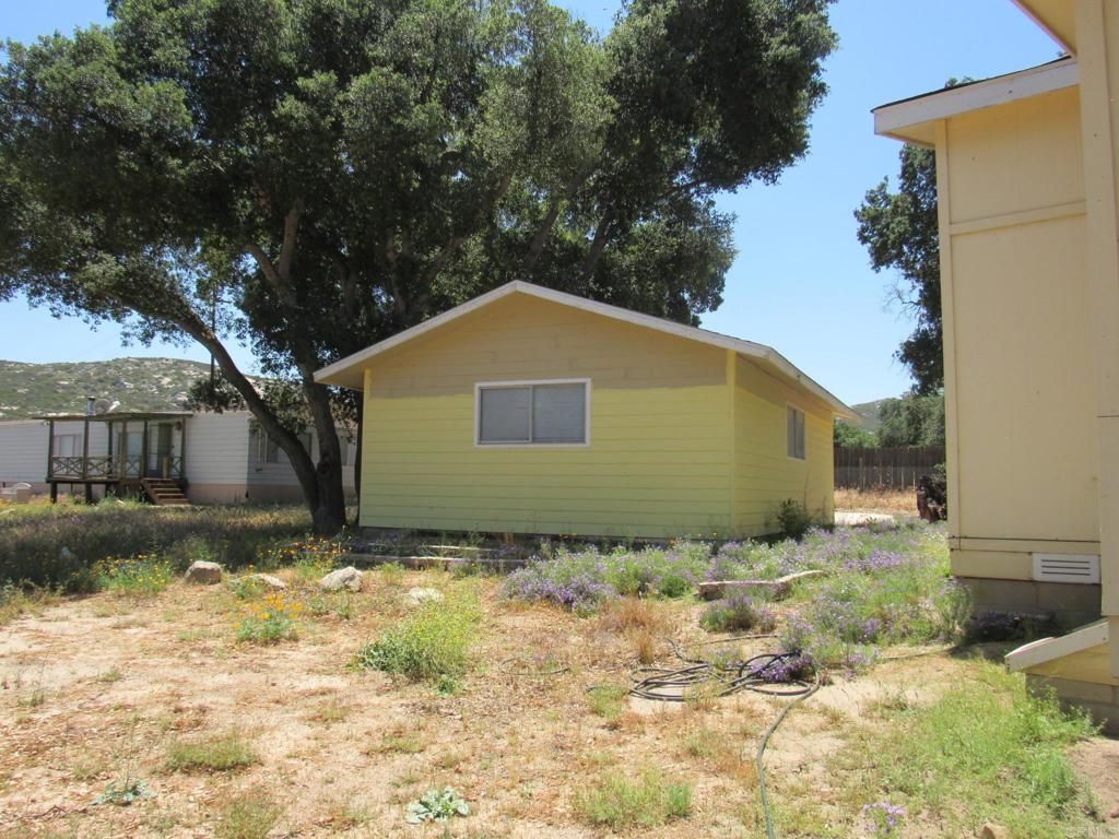 1124 Far Valley Road Campo, CA 91906 - Photo 3 of 21 a house with a yard
