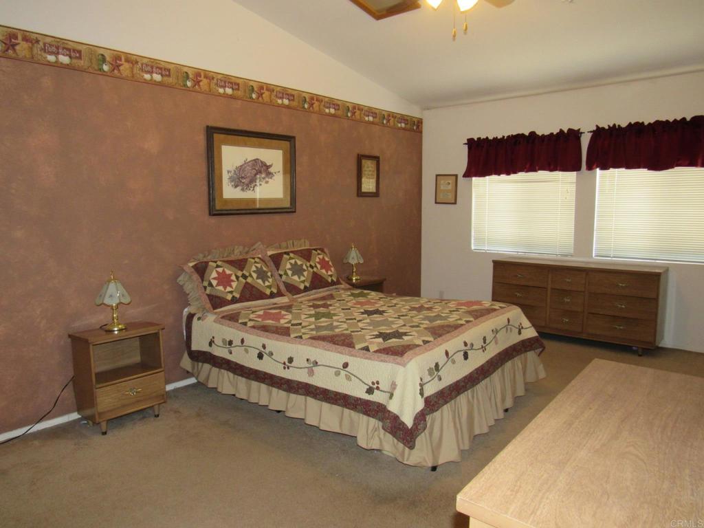 1124 Far Valley Road Campo, CA 91906 - Photo 8 of 21 a spacious bedroom with a bed and window