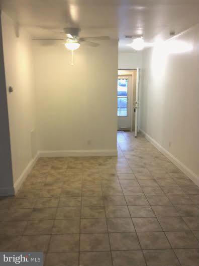 7527 Greenleaf Road Landover, MD 20785 - Photo 7 of 15 a view of an empty room with window and bathroom