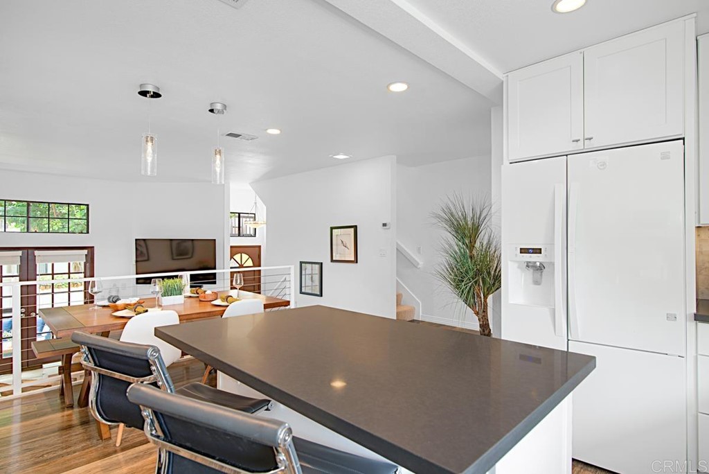 2372 Altisma Way, Unit C Carlsbad, CA 92009 - Photo 13 of 30 a living room with furniture pool table and a flat screen tv