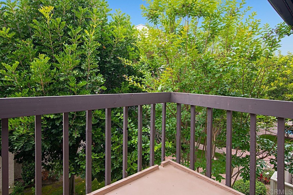 2372 Altisma Way, Unit C Carlsbad, CA 92009 - Photo 22 of 30 a view of a wooden fence from a balcony