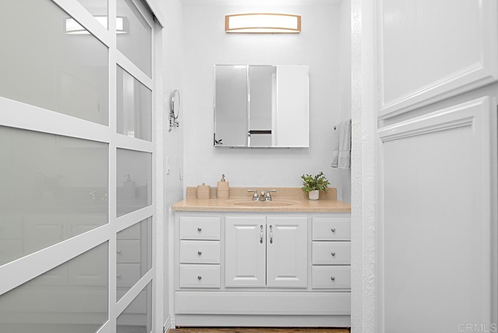 2372 Altisma Way, Unit C Carlsbad, CA 92009 - Photo 23 of 30 a view of cabinets and wooden floor