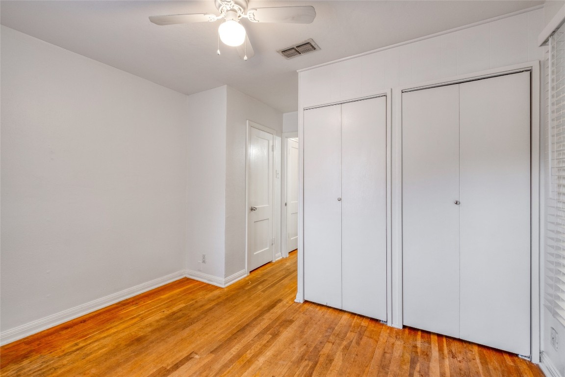 611 Genard Street Austin, TX 78751 - Photo 11 of 26 a view of empty room with wooden floor and fan
