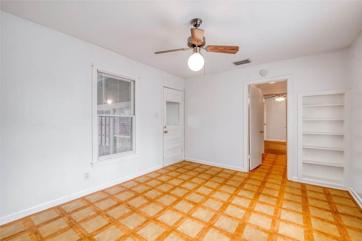 611 Genard Street Austin, TX 78751 - Photo 18 of 26 a bedroom with a bed and a window