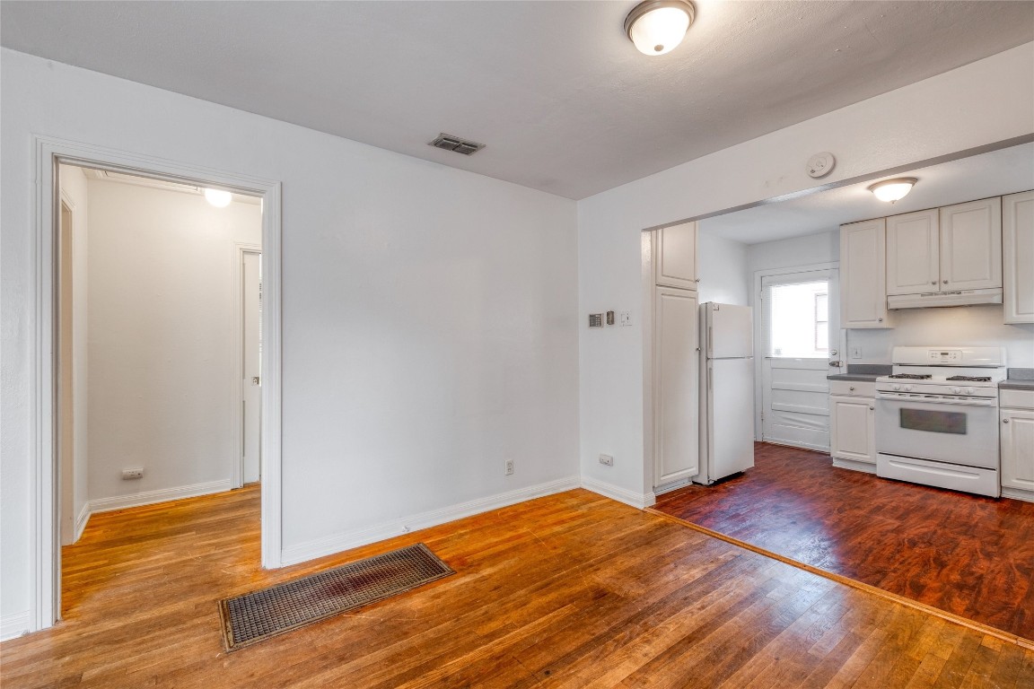 611 Genard Street Austin, TX 78751 - Photo 6 of 26 a view of a kitchen with wooden floor and a sink