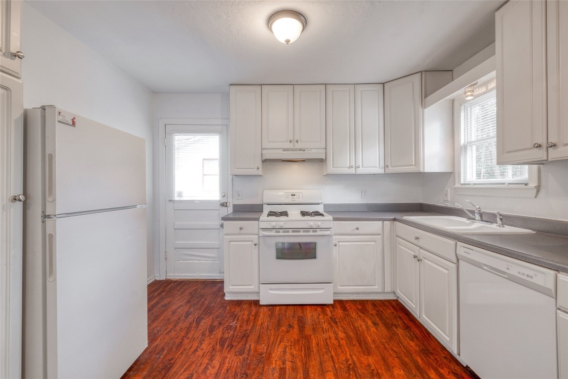 611 Genard Street Austin, TX 78751 - Photo 7 of 26 a kitchen with a refrigerator sink and cabinets