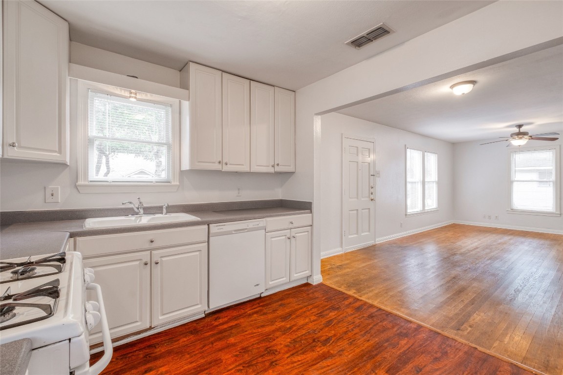 611 Genard Street Austin, TX 78751 - Photo 8 of 26 a kitchen with granite countertop white cabinets and white appliances