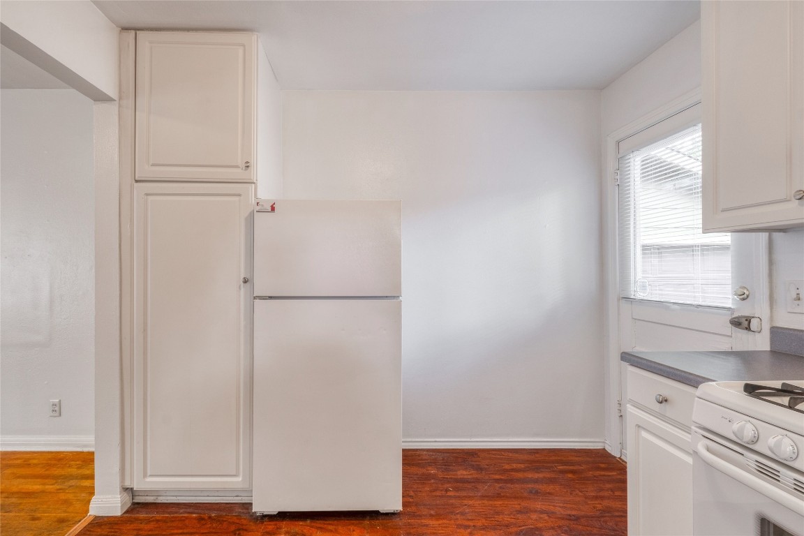 611 Genard Street Austin, TX 78751 - Photo 9 of 26 a view of cabinets with wooden floor