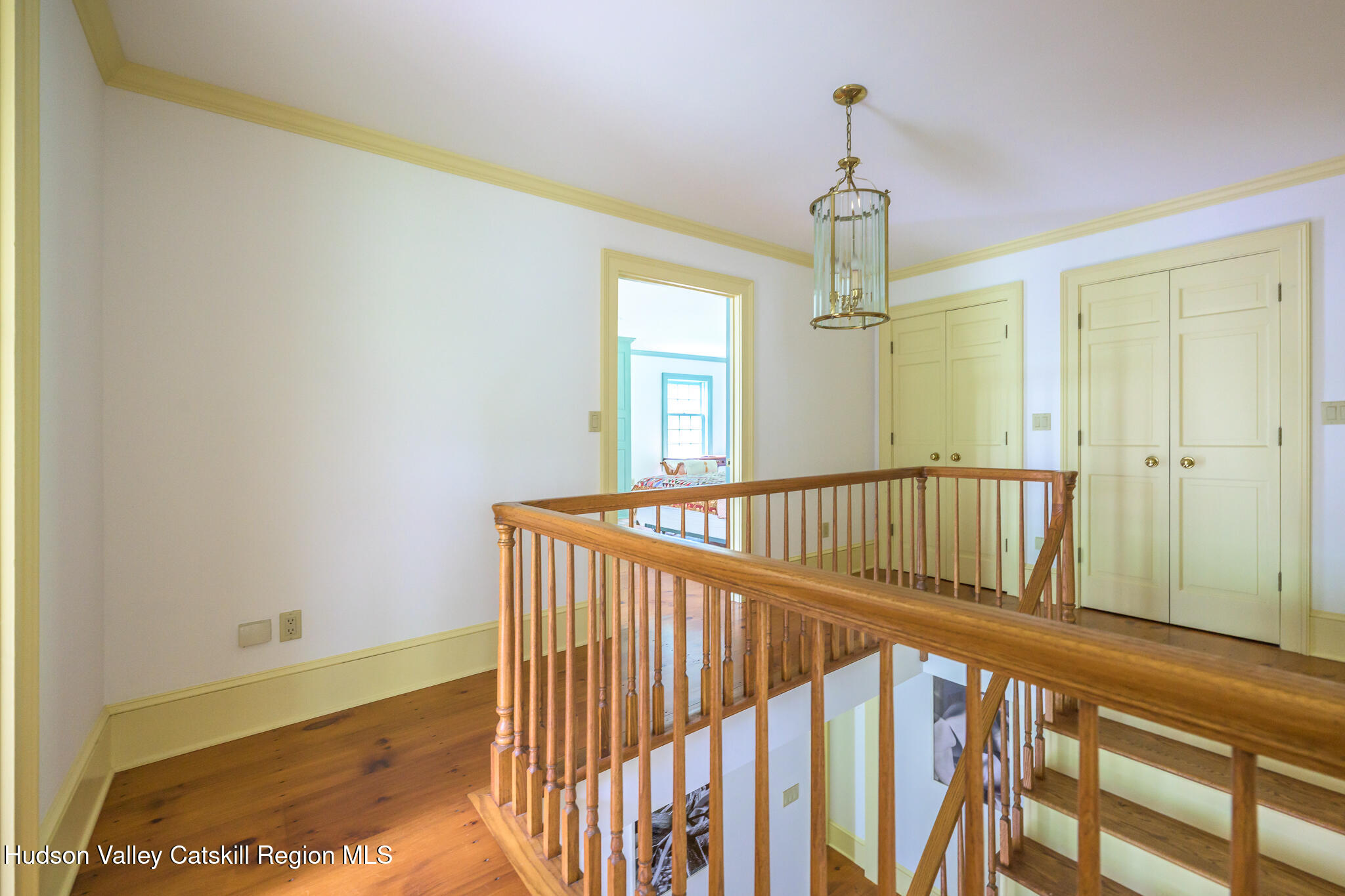 7 Partridge Drive Austerlitz, NY 12017 - Photo 28 of 46 a view of a hallway with wooden floor and staircase