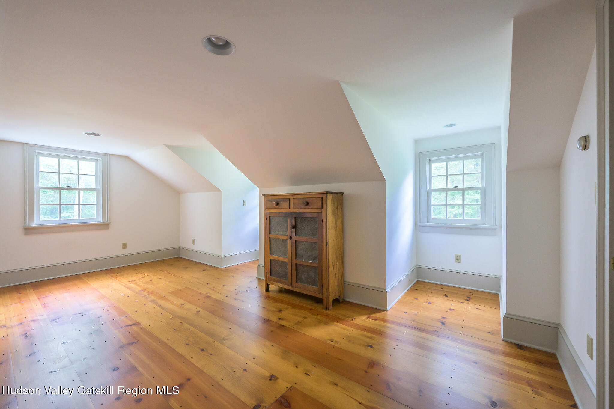 7 Partridge Drive Austerlitz, NY 12017 - Photo 37 of 46 an empty room with wooden floor and windows
