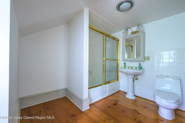 a bathroom with a sink and mirror