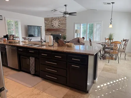 a kitchen with a sink and cabinets