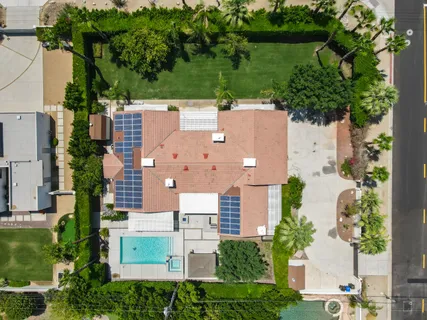 an aerial view of residential houses with outdoor space