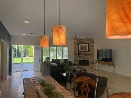 a living room with fireplace furniture and a flat screen tv