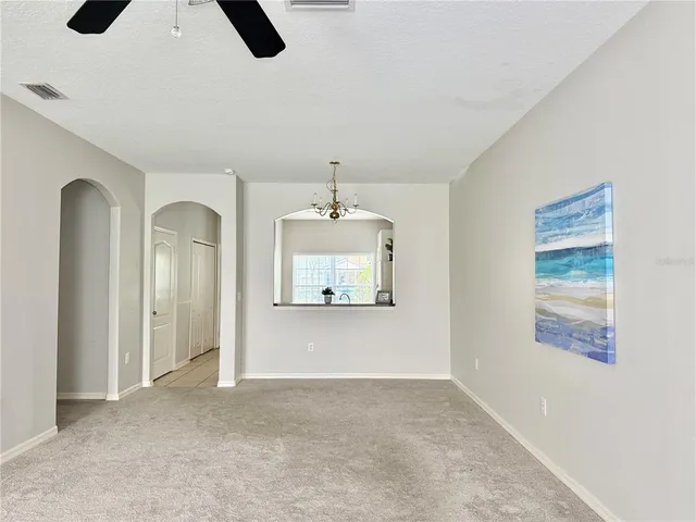 a view of empty room with windows