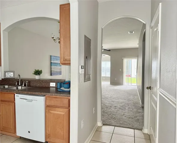 a bathroom with a granite countertop sink a mirror and a shower