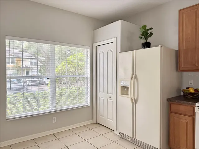 a white refrigerator freezer sitting in a kitchen