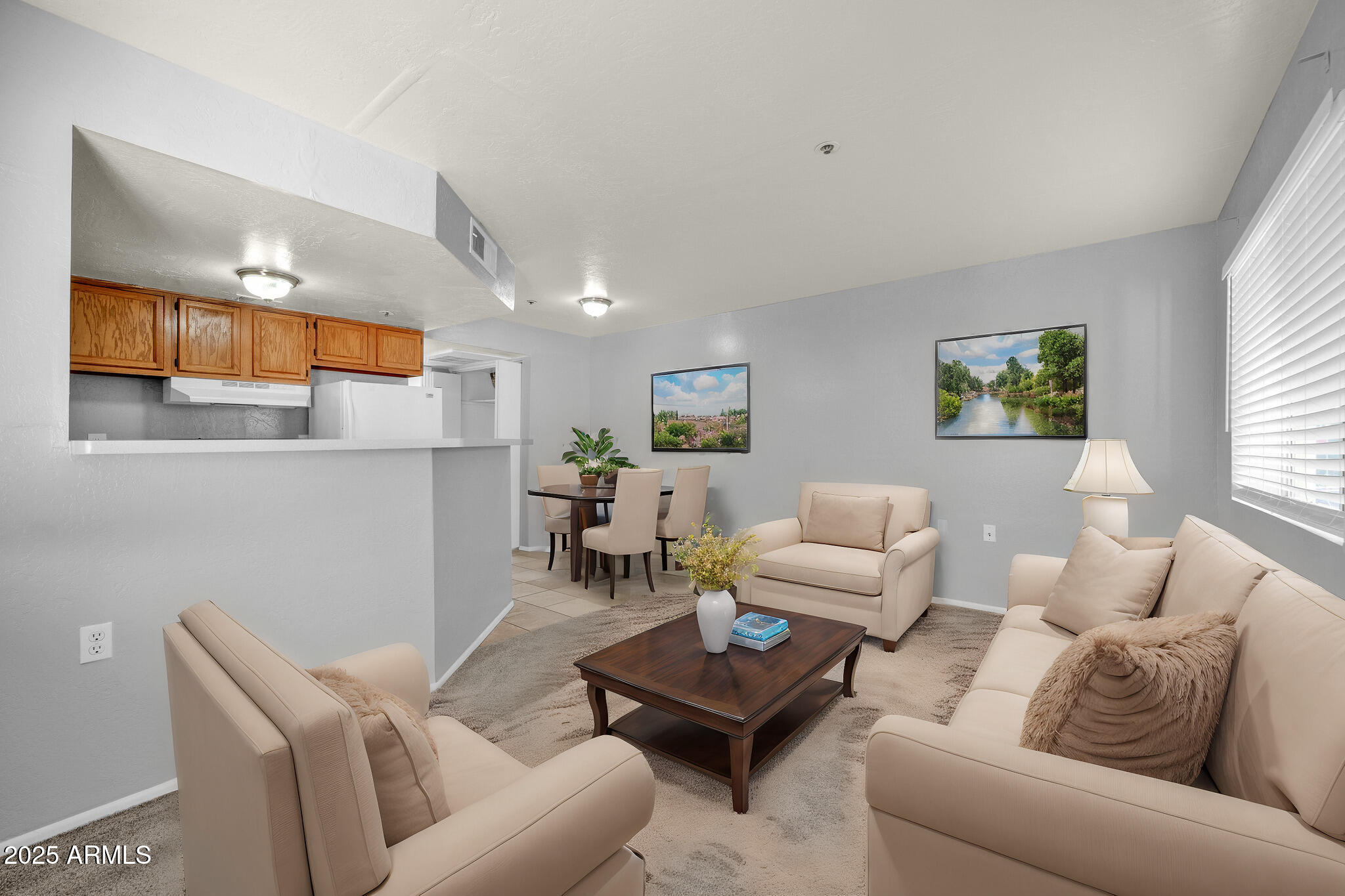 12221 West Bell Road, Unit 187 Surprise, AZ 85378 - Photo 1 of 11 a living room with furniture and a large window