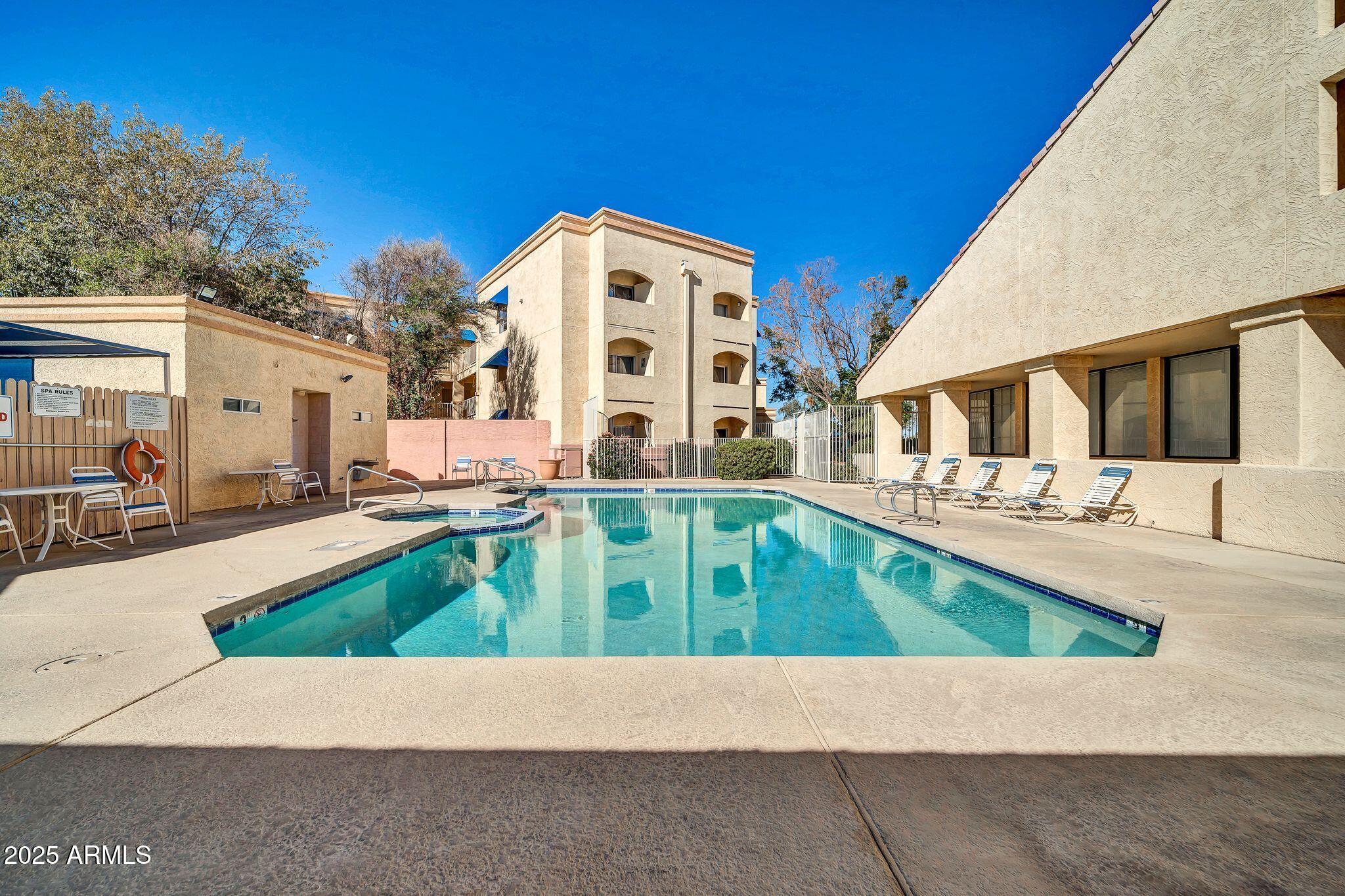 12221 West Bell Road, Unit 187 Surprise, AZ 85378 - Photo 9 of 11 a house view with a outdoor space