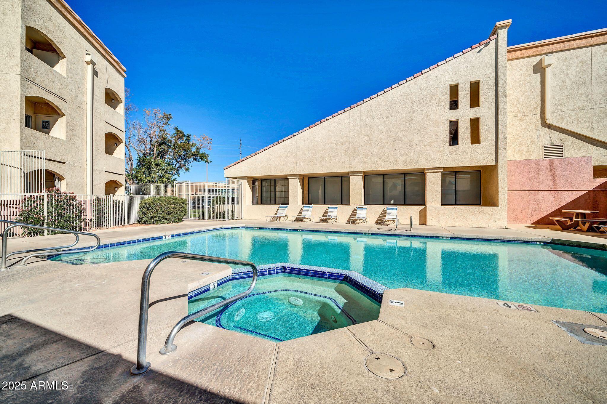 12221 West Bell Road, Unit 187 Surprise, AZ 85378 - Photo 10 of 11 a view of house with a swimming pool