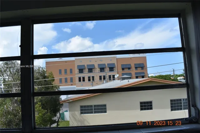 a front view of building with balcony