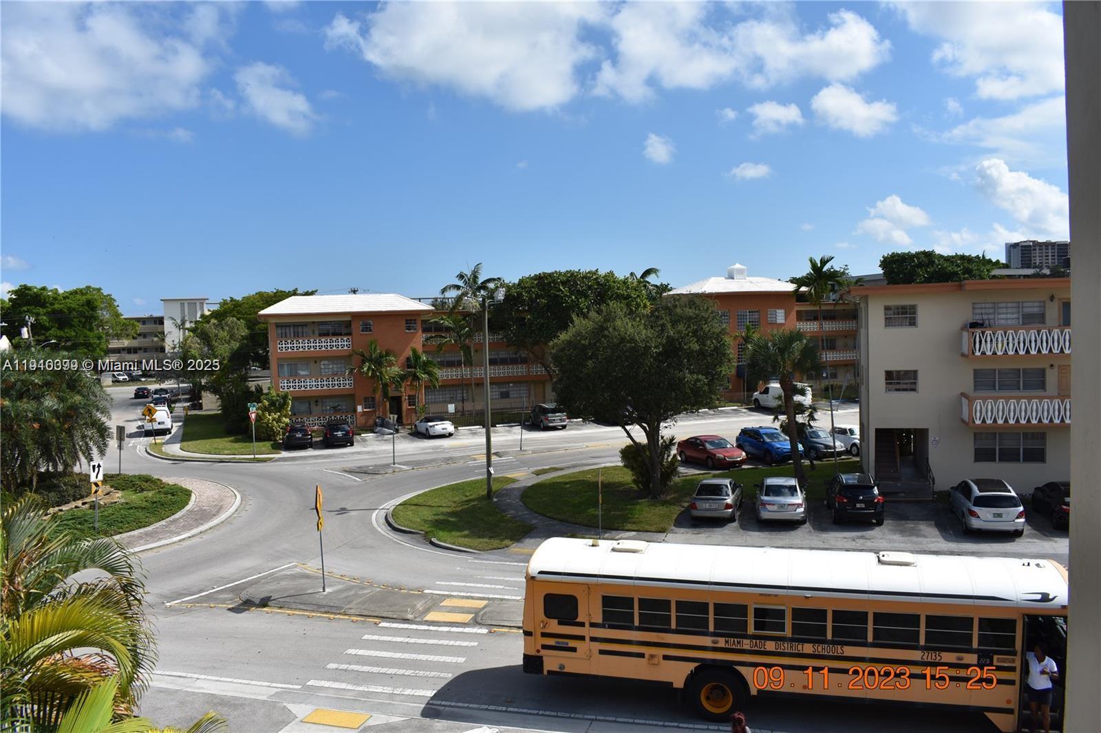 1885 Northeast 121st Street, Unit 23 North Miami, FL 33181 - Photo 20 of 22 a view of a street with cars