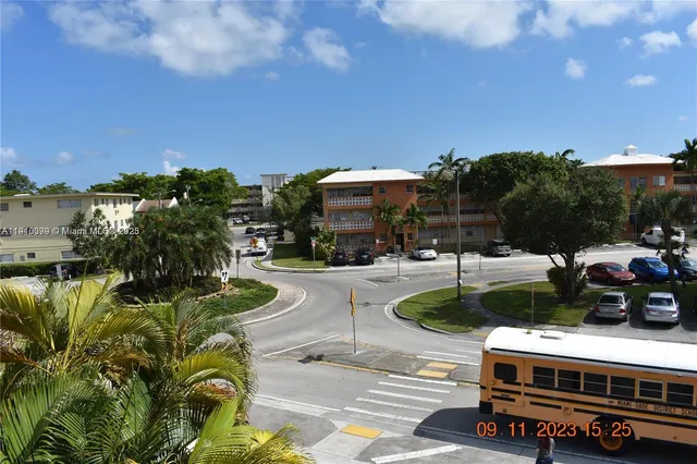 a view of a swimming pool with outdoor seating