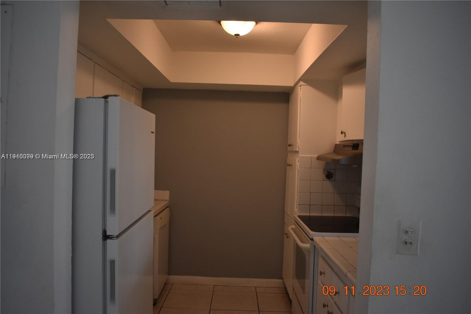 1885 Northeast 121st Street, Unit 23 North Miami, FL 33181 - Photo 6 of 22 a bathroom with a shower and toilet