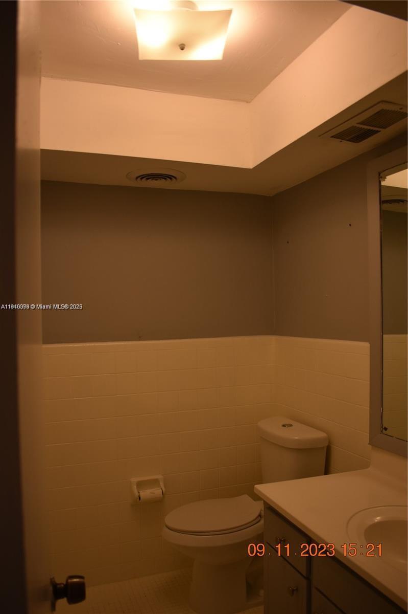 1885 Northeast 121st Street, Unit 23 North Miami, FL 33181 - Photo 8 of 22 a bathroom with a toilet