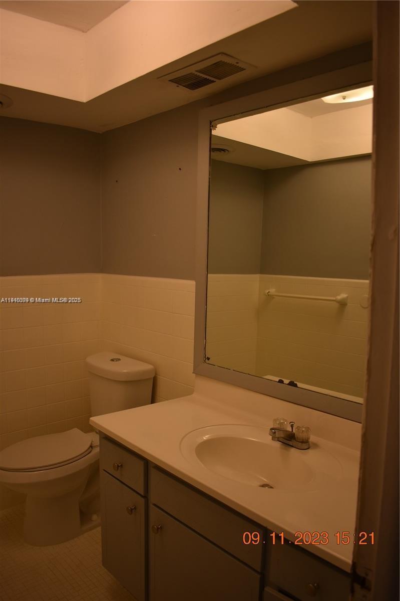 1885 Northeast 121st Street, Unit 23 North Miami, FL 33181 - Photo 9 of 22 a bathroom with a sink and a toilet