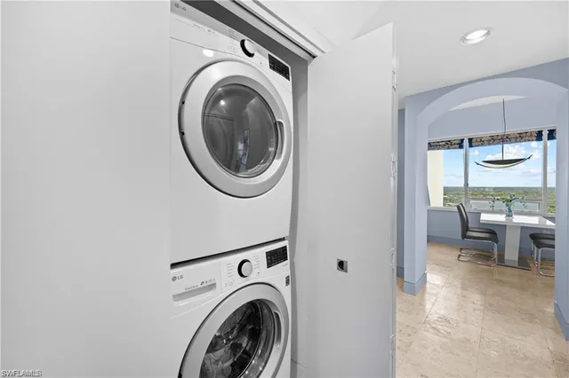 a view of a hallway with washer and dryer