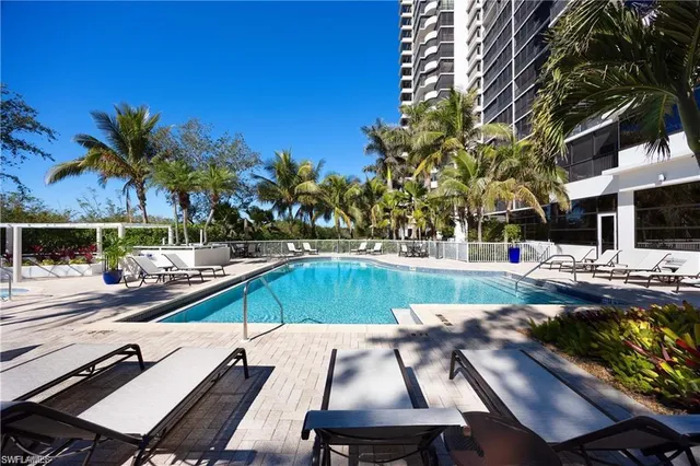 a view of a patio with swimming pool