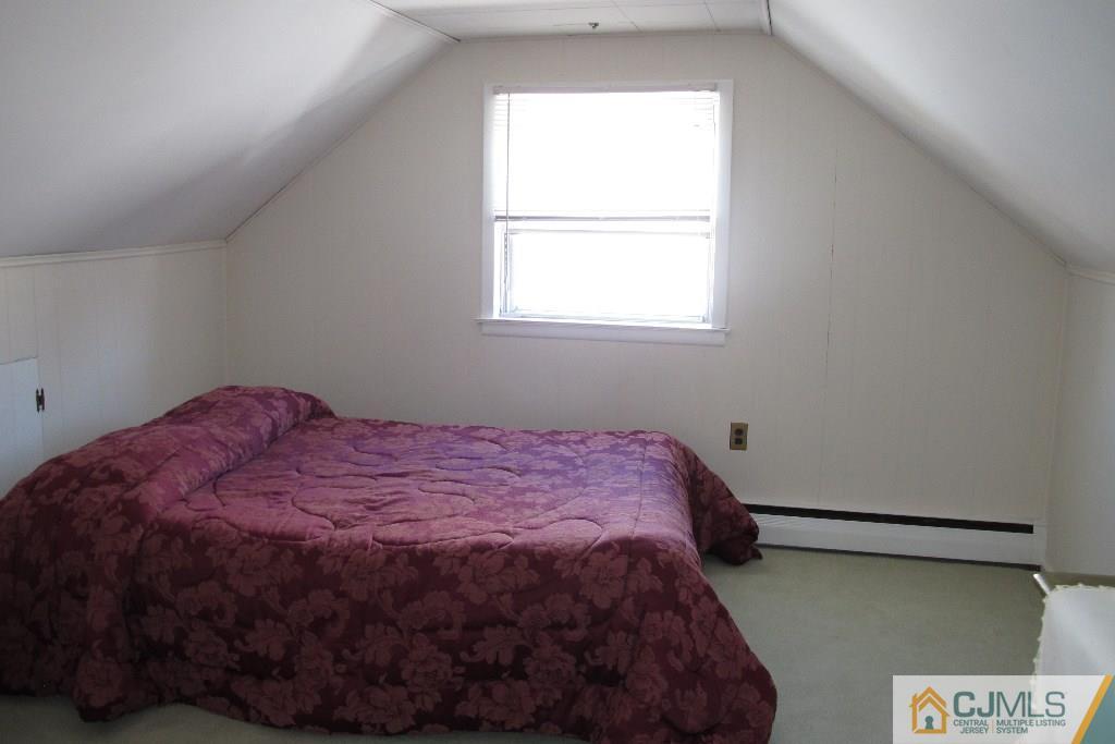 95 Brandywine Road Fords, NJ 08863 - Photo 13 of 23 a bed sitting in a bedroom next to a window
