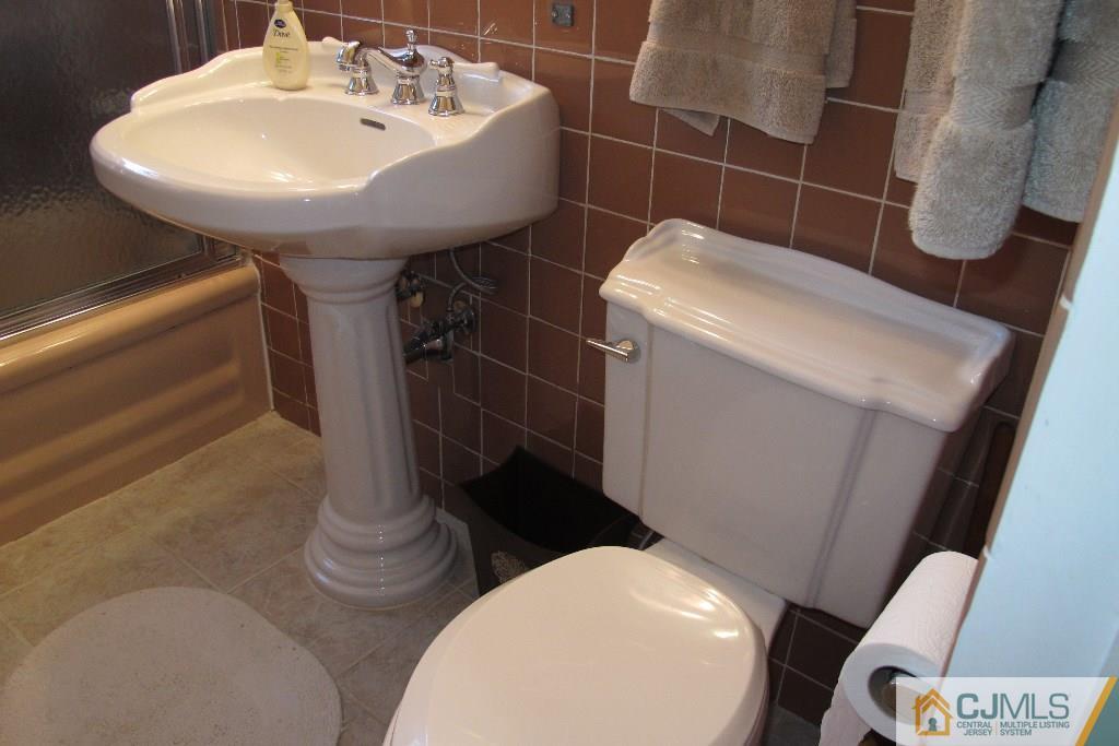 95 Brandywine Road Fords, NJ 08863 - Photo 15 of 23 a bathroom with a sink toilet and shower