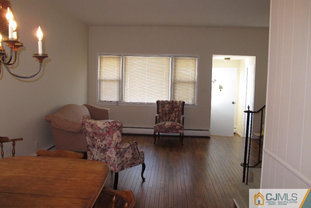 95 Brandywine Road Fords, NJ 08863 - Photo 4 of 23 a living room with furniture a window and wooden floor