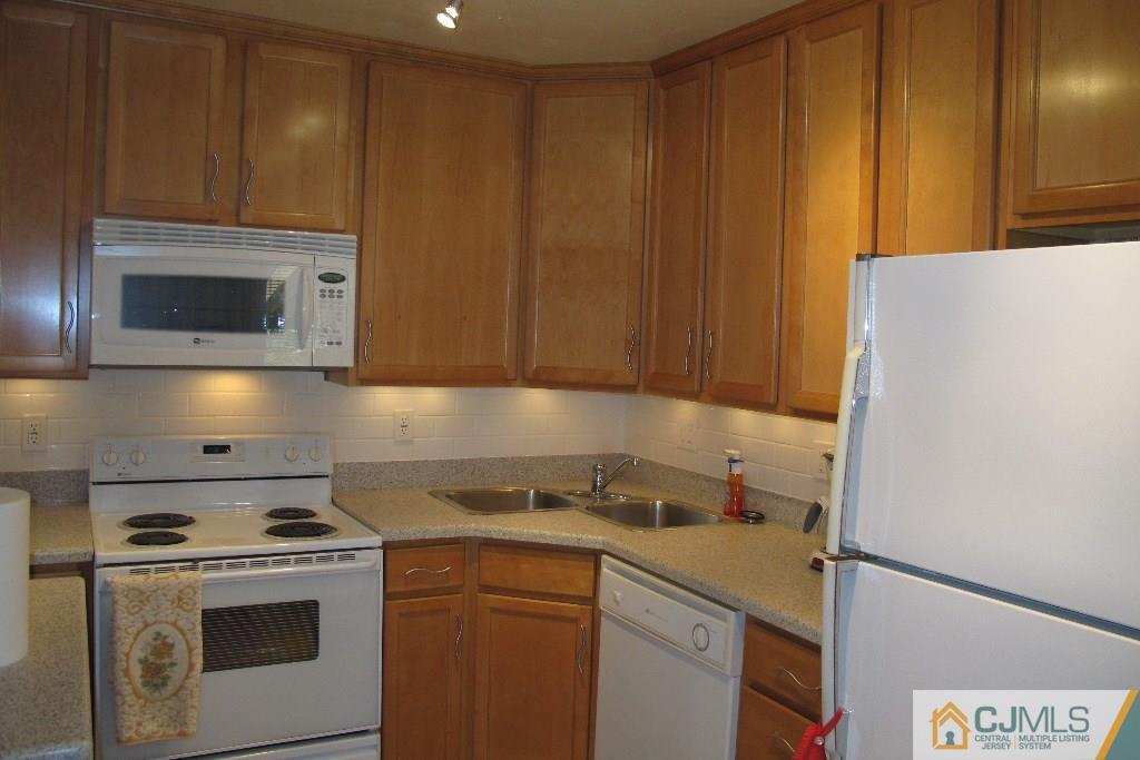 95 Brandywine Road Fords, NJ 08863 - Photo 5 of 23 a kitchen with a stove and a microwave