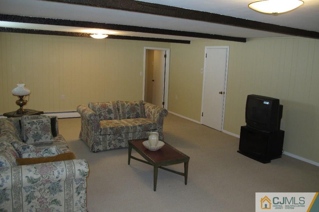95 Brandywine Road Fords, NJ 08863 - Photo 7 of 23 a living room with furniture and a table