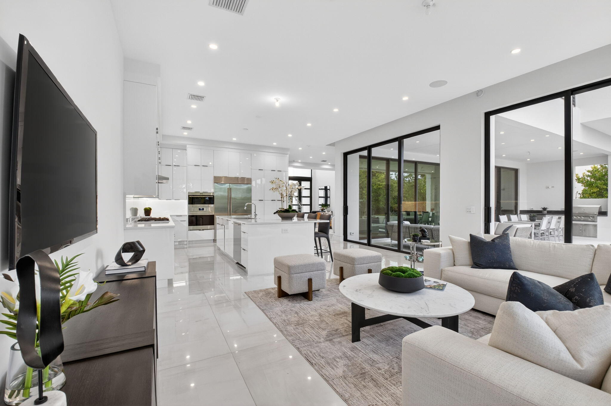 2232 Delray Ridge Lane Delray Beach, FL 33444 - Photo 24 of 68 a living room with furniture and a flat screen tv